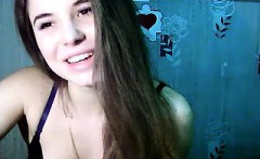 Sexy little brunette is on her live webcam chatting and sho