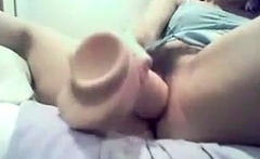 A naughty babe having fun dildoing her tight pussy
